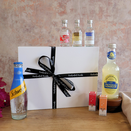 absolut vodka gift set. 3 absolut vodka miniatures. 2 bottles of mixer. 2 bottle of shimmer for drinks. Luxury gift box with branded ribbon. 
